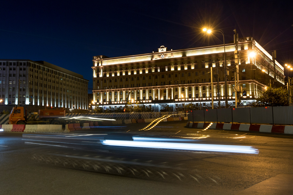 FILE - Car passes the building of the Federal Security Service (FSB, Soviet KGB successor) in Lubyanskaya Square in Moscow, Russia, on Monday, July 24, 2017. (AP Photo, File)