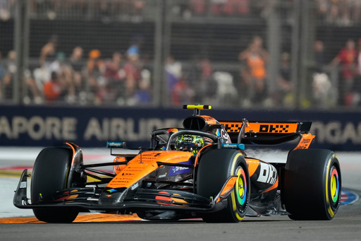 McLaren driver Lando Norris of Britain steers his car during the Singapore Formula One Grand Prix at the Marina Bay Street Circuit in Singapore, Sunday, Oct. 5, 2025. (AP Photo/Vincent Thian) McLaren driver Lando Norris of Britain steers his car during the Singapore Formula One Grand Prix at the Marina Bay Street Circuit in Singapore, Sunday, Oct. 5, 2025. (AP Photo/Vincent Thian)