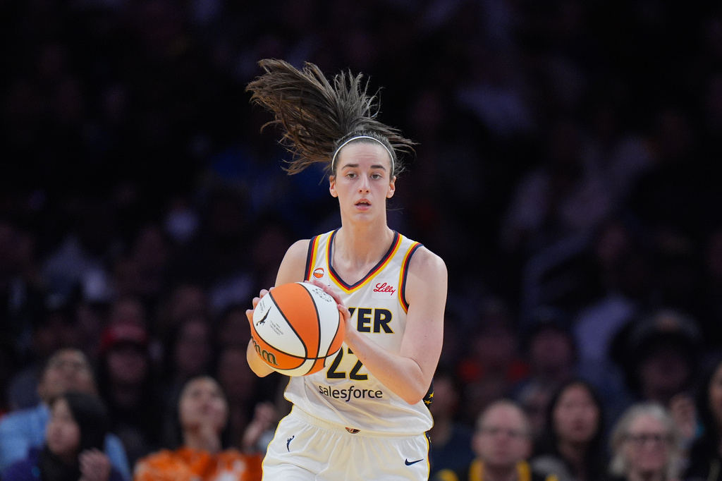 Indiana Fever guard Caitlin Clark (22) dribbles during the first half of a WNBA basketball game against the Los Angeles Sparks Wednesday, May 13, 2026, in Los Angeles. (AP Photo/Jae C. Hong)