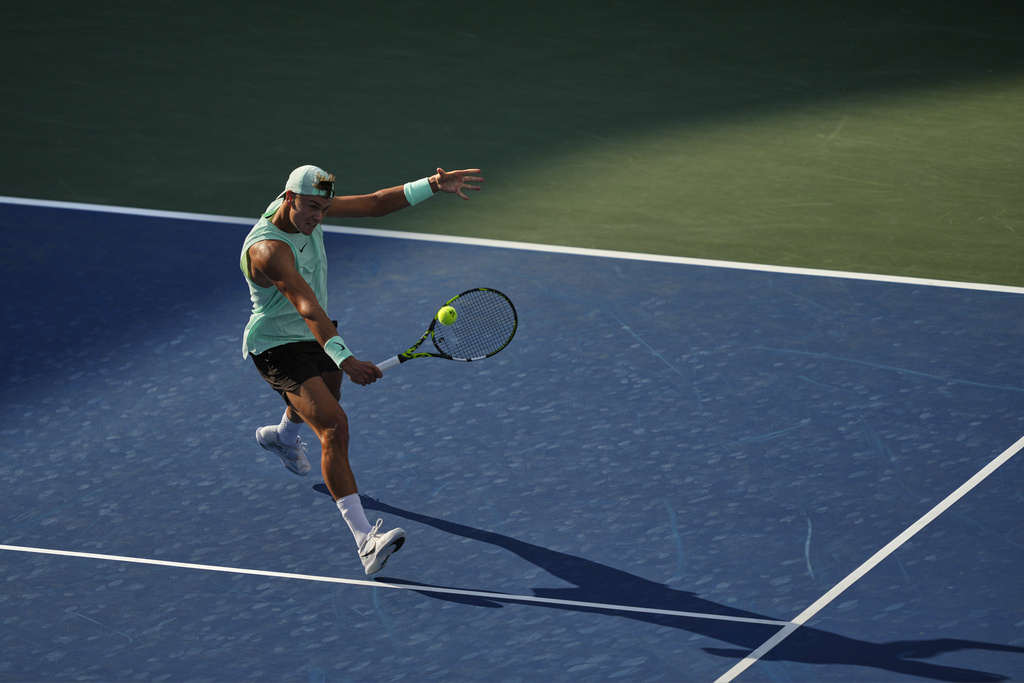 Holger Rune, of Denmark, returns a shot to Botic van De Zandschulp, of the Netherlands, during the first round of the US Open tennis championships, Monday, Aug. 25, 2025, in New York. (AP Photo/Yuki Iwamura)