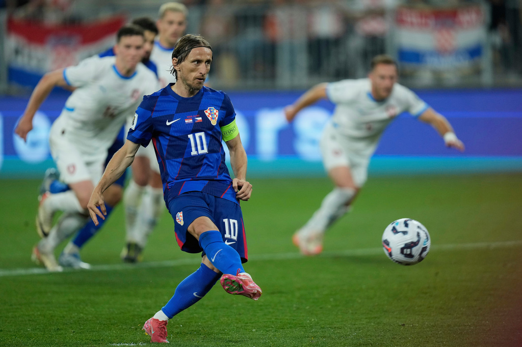 FILE - Croatia's Luka Modric scores his side's second goal from a penalty spot during a World Cup 2026 group L qualifying soccer match between Croatia and Czech Republic at the Opus Arena in Osijek, Croatia, Monday, June 9, 2025. (AP Photo/Darko Bandic, File)