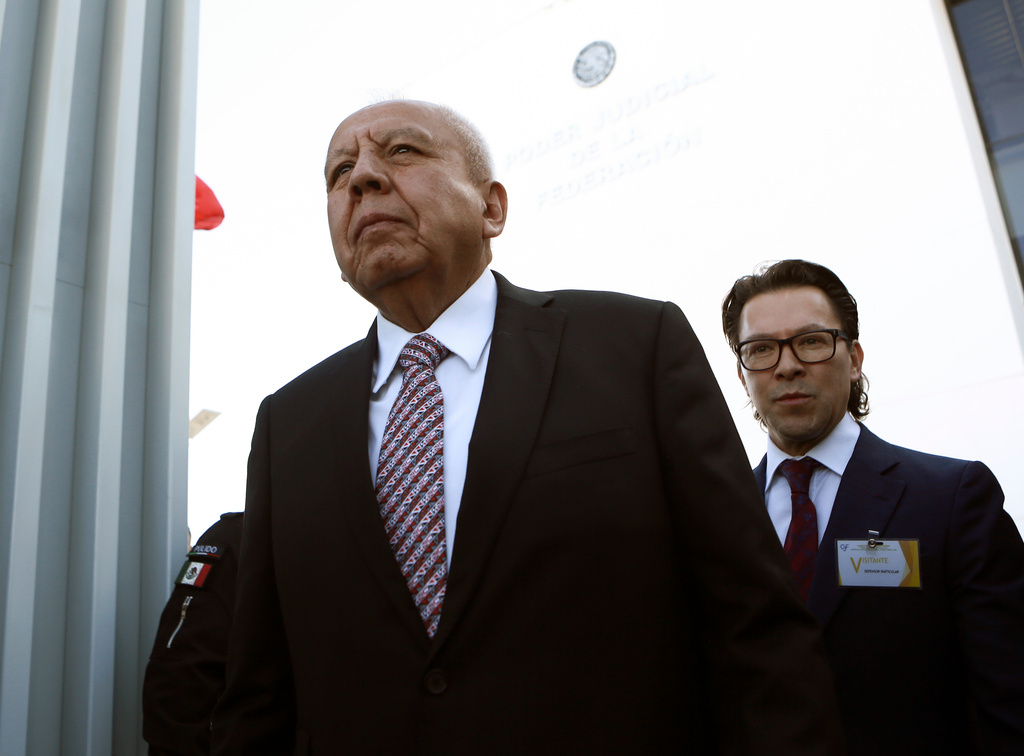 FILE - Mexican National Immigration Institute Chief Francisco Gardu&ntilde;o, front, arrives to court in Ciudad Juarez, Mexico, April 21, 2023. (AP Photo/Christian Chavez, File)