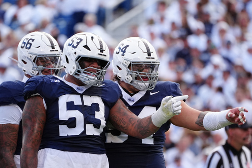 Penn State's offensive linemen Nick Dawkins (53) and TJ Shanahan Jr. (54) point during the second quarter of an NCAA college football game against Northwestern, Saturday, Oct. 11, 2025, in State College, Pa. (AP Photo/Caleb Craig) Penn State's offensive linemen Nick Dawkins (53) and TJ Shanahan Jr. (54) point during the second quarter of an NCAA college football game against Northwestern, Saturday, Oct. 11, 2025, in State College, Pa. (AP Photo/Caleb Craig)