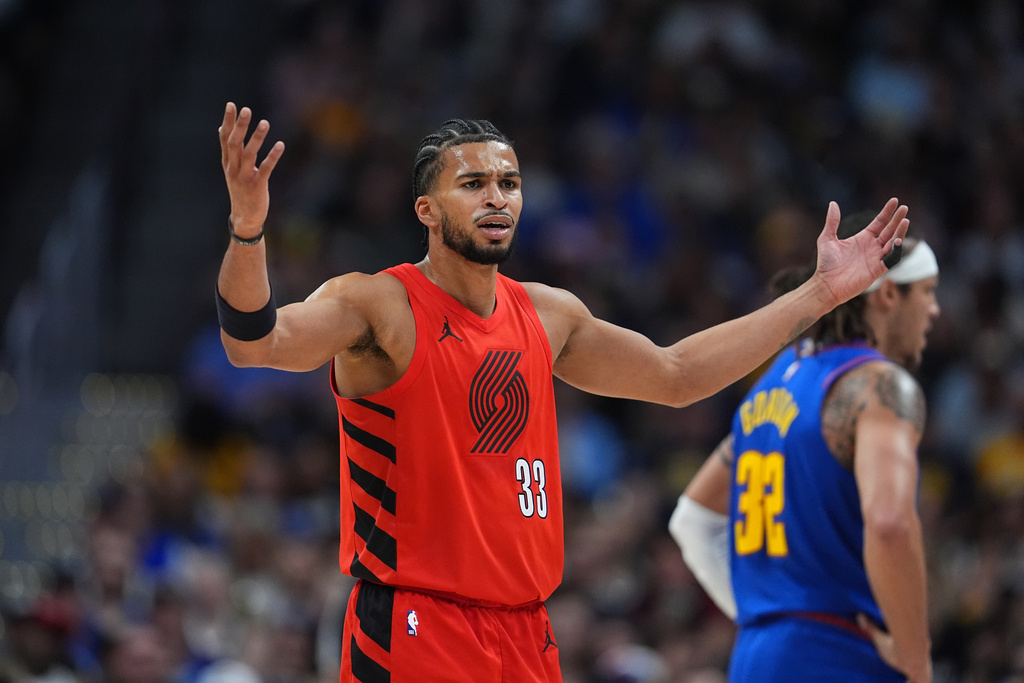 Portland Trail Blazers forward Toumani Camara (33) argues after he was called for a foul in the first half of an NBA basketball game against the Denver Nuggets, Sunday, March 22, 2026, in Denver. (AP Photo/David Zalubowski)