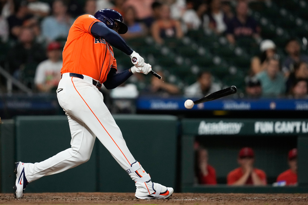 Houston Astros' Yordan Alvarez breaks a bat during the ninth inning of a baseball game against the Los Angeles Angels in Houston, Friday, March 27, 2026. (AP Photo/Ashley Landis)