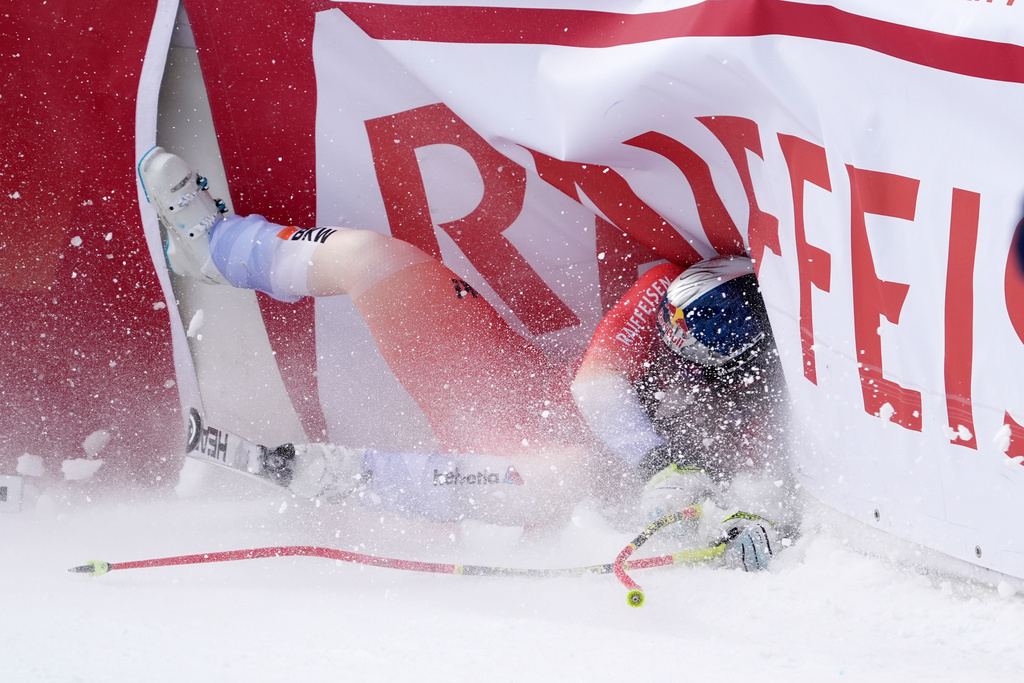 Switzerland's Franjo von Allmen crashes at the finish area of an alpine ski, men's World Cup downhill, in Wengen, Switzerland, Saturday, Jan. 17, 2026. (AP Photo/Giovanni Zenoni)