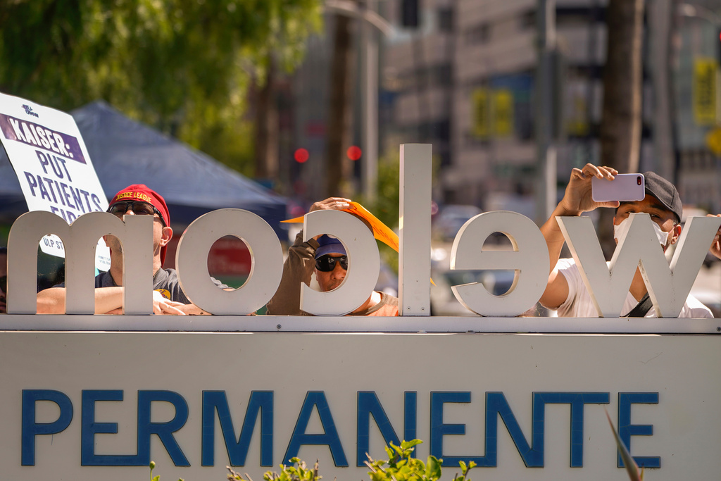 FILE - Kaiser Permanente frontline healthcare workers picket outside the Kaiser Permanente Los Angeles Medical Center in Los Angeles on Friday, Oct. 6, 2023. (AP Photo/Damian Dovarganes, File)