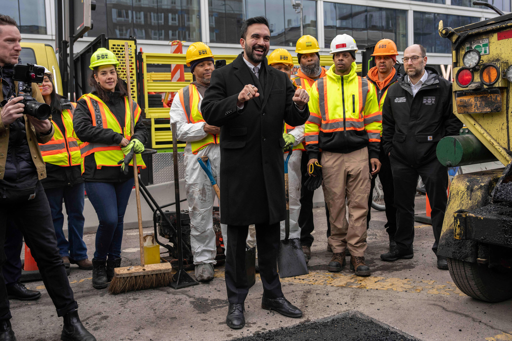 FILE - New York Mayor Zohran Mamdani and Department of Transportation workers fix a bump near the Williamsburg Bridge on Jan. 6, 2026, in New York. (AP Photo/Yuki Iwamura, File)