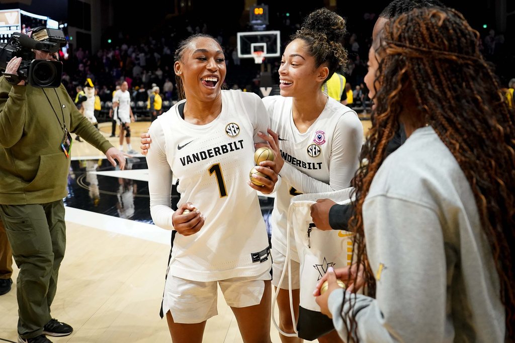 Vanderbilt guard Mikayla Blakes (1) celebrates with guard Jada Brown after defeating LSU in an NCAA college basketball game, Sunday, Jan. 4, 2026, in Nashville, Tenn. (AP Photo/Camden Hall)