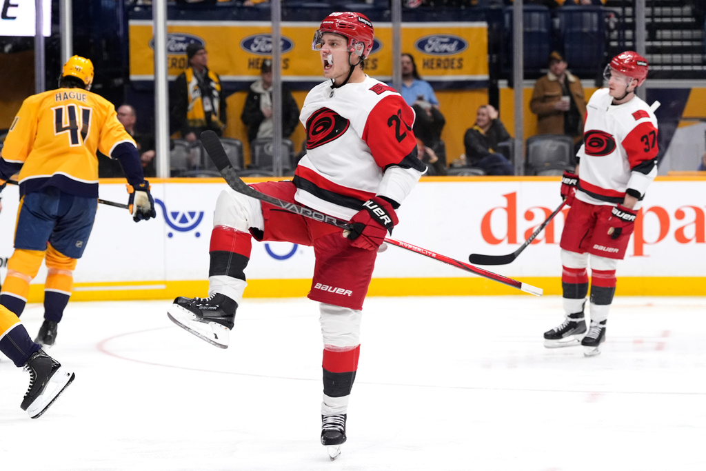 Carolina Hurricanes center Sebastian Aho (20) celebrates his goal during the third period of an NHL hockey game against the Nashville Predators, Wednesday, Dec. 17, 2025, in Nashville, Tenn. (AP Photo/George Walker IV)