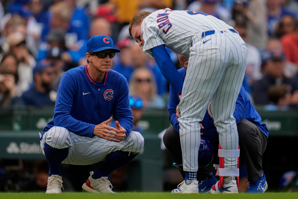 FILE - Chicago Cubs manager Craig Counsell (11), left, checks on Pete Crow-Armstrong (4) during the sixth inning of a baseball game against the Washington Nationals, Sept. 6, 2025, in Chicago. (AP Photo/Erin Hooley, File)