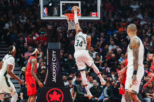 Milwaukee Bucks' Giannis Antetokounmpo (34) dunks on the Toronto Raptors net during first half NBA basketball action in Toronto on Friday, Oct. 24, 2025. (Nick Iwanyshyn/The Canadian Press via AP) Milwaukee Bucks' Giannis Antetokounmpo (34) dunks on the Toronto Raptors net during first half NBA basketball action in Toronto on Friday, Oct. 24, 2025. (Nick Iwanyshyn/The Canadian Press via AP)