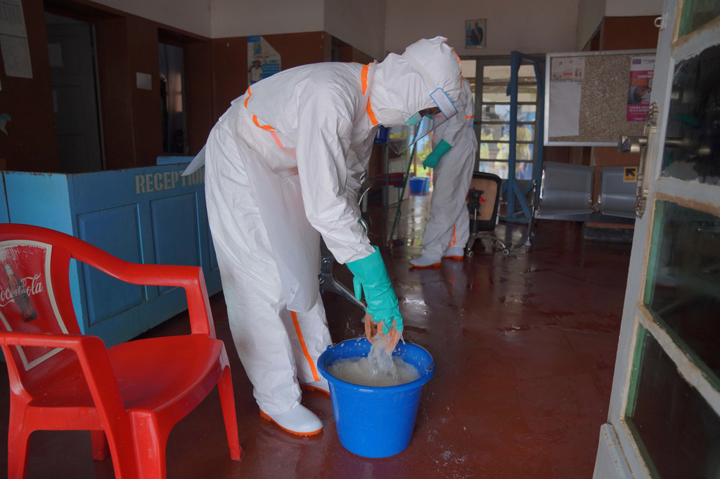 A health worker in protective gear prepares to mop the floor at an ebola treatment centre in Bunia, Congo, Monday, Aug. 10, 2026. (AP Photo/Dieudonne Dirole)