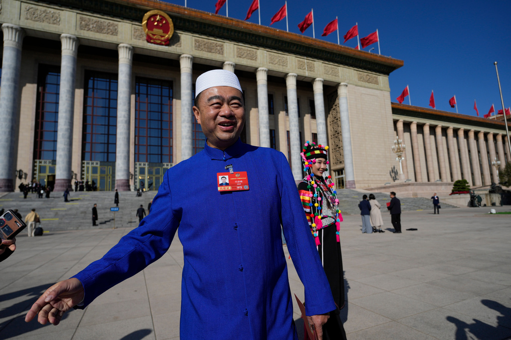 Ethnic minority delegate leave after the closing ceremony of the Chinese People's Political Consultative Conference (CPPCC), in Beijing, Wednesday, March 11, 2026. (AP Photo/Ng Han Guan)