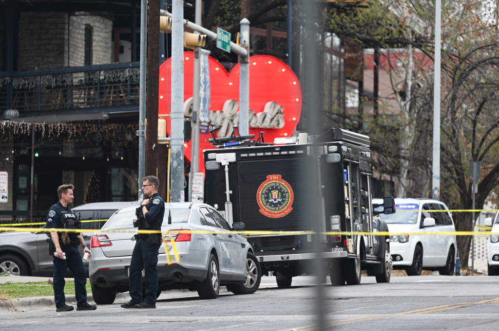 The Austin Police Department and the FBI investigate a shooting at Buford's on 6th Street on Sunday, March 1, 2026, in Austin, Texas. (AP Photo/Jack Myer)