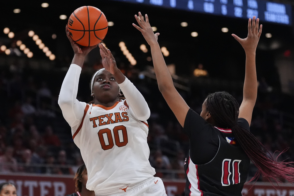 Texas center Kyla Oldacre (00) shoots over Louisiana Lafayette forward Arionna Patterson (11) during the second half of an NCAA college basketball game in Austin, Texas, Monday, Nov. 10, 2025. (AP Photo/Eric Gay)