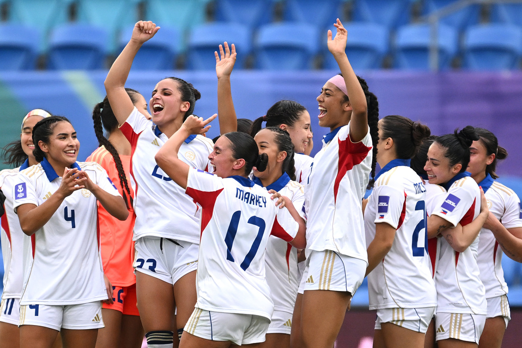 Philippines players celebrate after defeating Uzbekistan in their Women's Asian Cup qualifying match for the World Cup, at Gold Coast Stadium In Robina, Australia, Thursday, March 19, 2026. (Dave Hunt/AAP Image via AP)