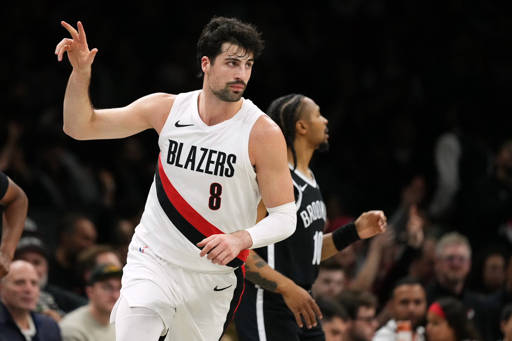 Portland Trail Blazers' Deni Avdija (8) gestures after making a three-point shot during the first half of an NBA basketball game against the Brooklyn Nets Monday, March 16, 2026, in New York. (AP Photo/Frank Franklin II)