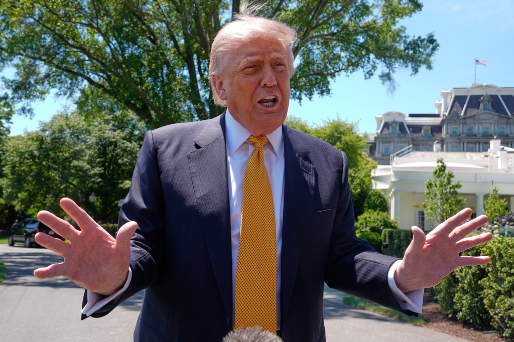 President Donald Trump speaks to reporters as he leaves the White House for travel to Beijing, Tuesday, May 12, 2026, in Washington, to meet with China's President Xi Jinping. (AP Photo/Manuel Balce Ceneta)