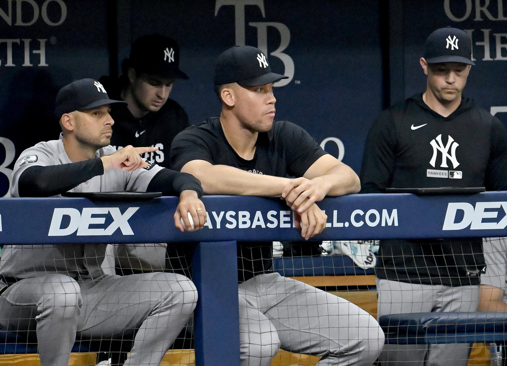New York Yankees assistant hitting coach Jake Hirst, left, and Aaron Judge watch from the dugout during the seventh inning of a baseball game Wednesday, July 8, 2026, in St. Petersburg, Fla. (AP Photo/Jason Behnken)