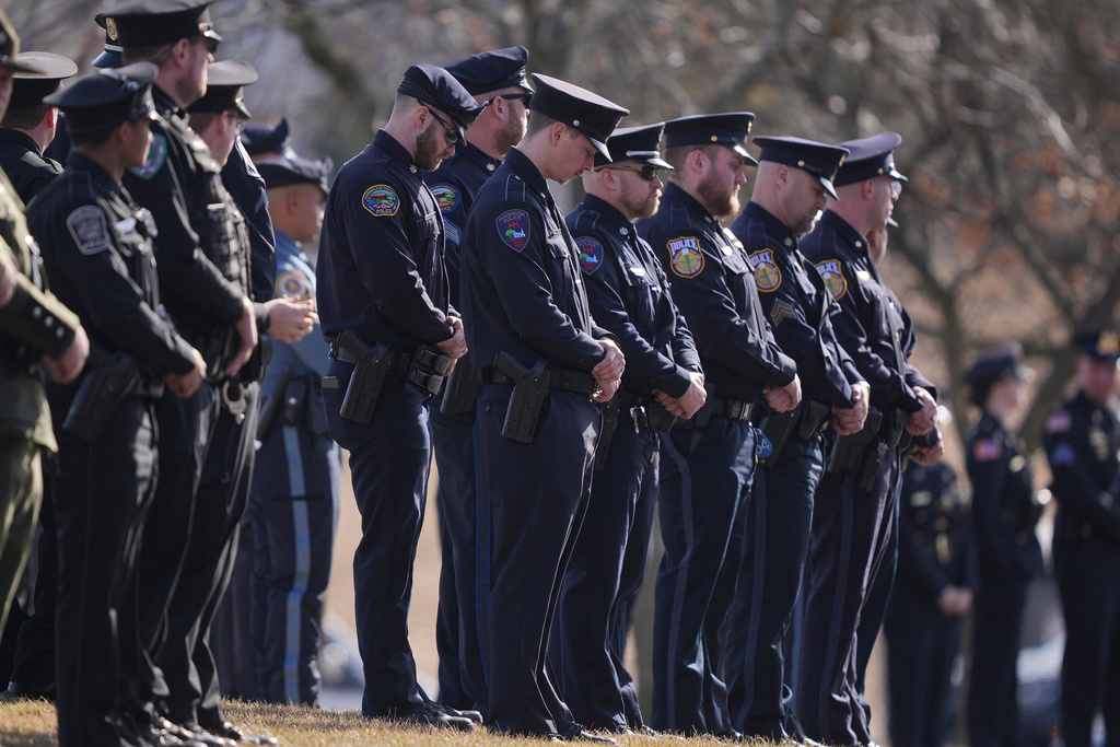 FILE - Officers wait for slain West York Borough Police Officer Andrew Duarte's funeral procession from Living Word Community Church, in Red Lion, Pa., Feb. 28, 2025. (AP Photo/Matt Rourke, File)