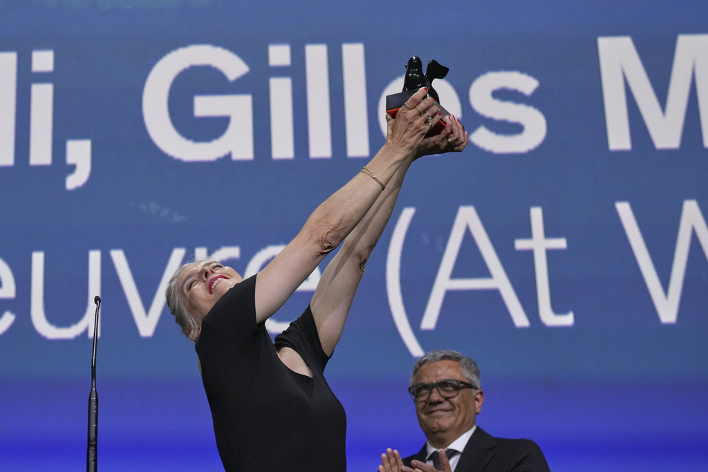 Valerie Donzelli accepts the best screenplay award for 'A pied d'oeuvre' during the awards ceremony of the 82nd edition of the Venice Film Festival in Venice, Italy, on Saturday, Sept. 6, 2025. (Photo by Alessandra Tarantino/Invision/AP)