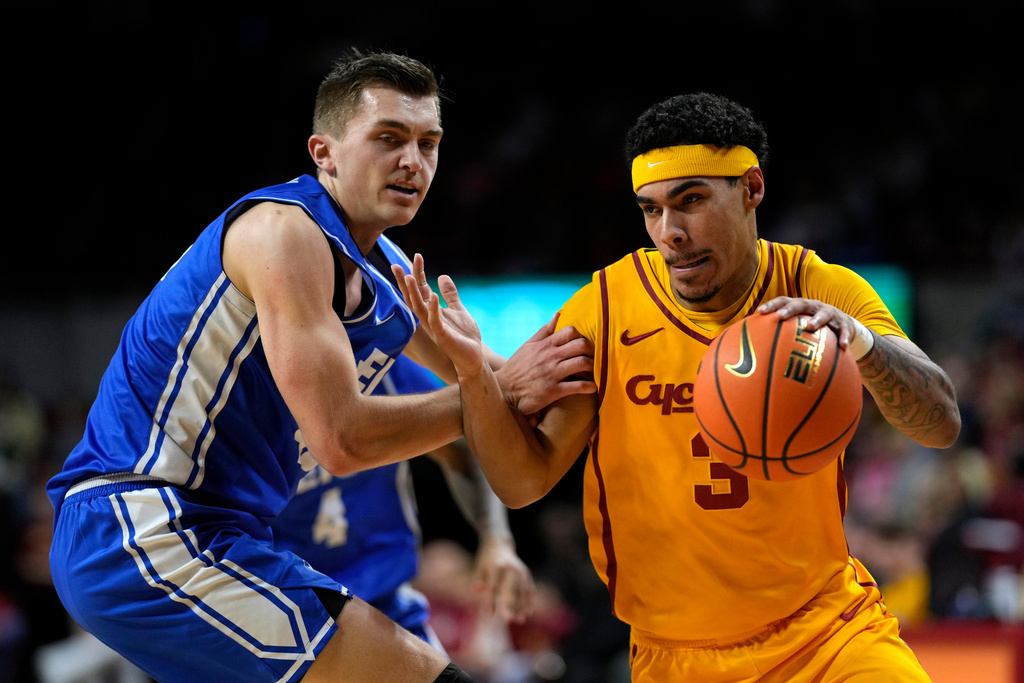 Iowa State guard Tamin Lipsey (3) drives past Eastern Illinois forward Kooper Jacobi (40) during the first half of an NCAA college basketball game, Sunday, Dec. 14, 2025, in Ames, Iowa. (AP Photo/Charlie Neibergall)