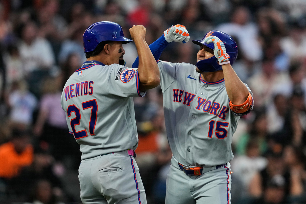 New York Mets' Tyrone Taylor, right, celebrates with Mark Vientos after hitting a three-run home run during the fifth inning of a baseball game against the San Francisco Giants, Saturday, April 4, 2026, in San Francisco. (AP Photo/Godofredo A. Vásquez)