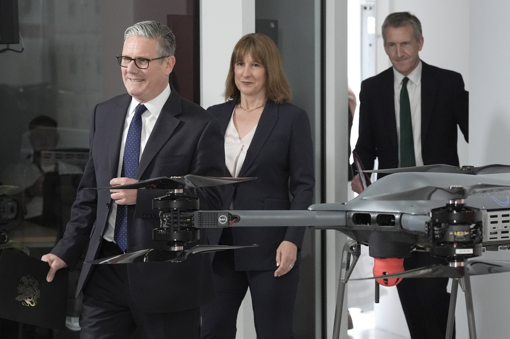 British Prime Minister Keir Starmer, left, followed by Chancellor of the Exchequer Rachel Reeves and Defense Secretary Dan Jarvis arrive for the announcement of a defense plan, in Berkshire, England, Tuesday, June 30, 2026. (Stefan Rousseau/Pool Photo via AP)