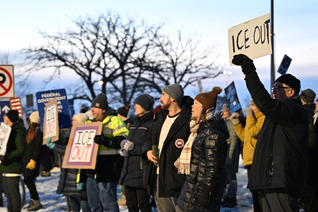 Protesters gather outside the Bishop Henry Whipple Federal Building, Thursday, Jan. 8, 2026, in Minneapolis, Minn. (AP Photo/Tom Baker)