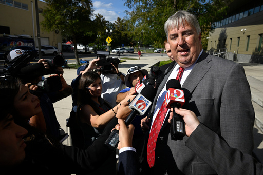Jim Trusty, right, an attorney representing Miami Heat guard Terry Rozier, talks with the media after leaving the federal courthouse following Rozier's arraignment proceedings, Thursday, Oct. 23, 2025, in Orlando, Fla. (AP Photo/Phelan M. Ebenhack) Jim Trusty, right, an attorney representing Miami Heat guard Terry Rozier, talks with the media after leaving the federal courthouse following Rozier's arraignment proceedings, Thursday, Oct. 23, 2025, in Orlando, Fla. (AP Photo/Phelan M. Ebenhack)