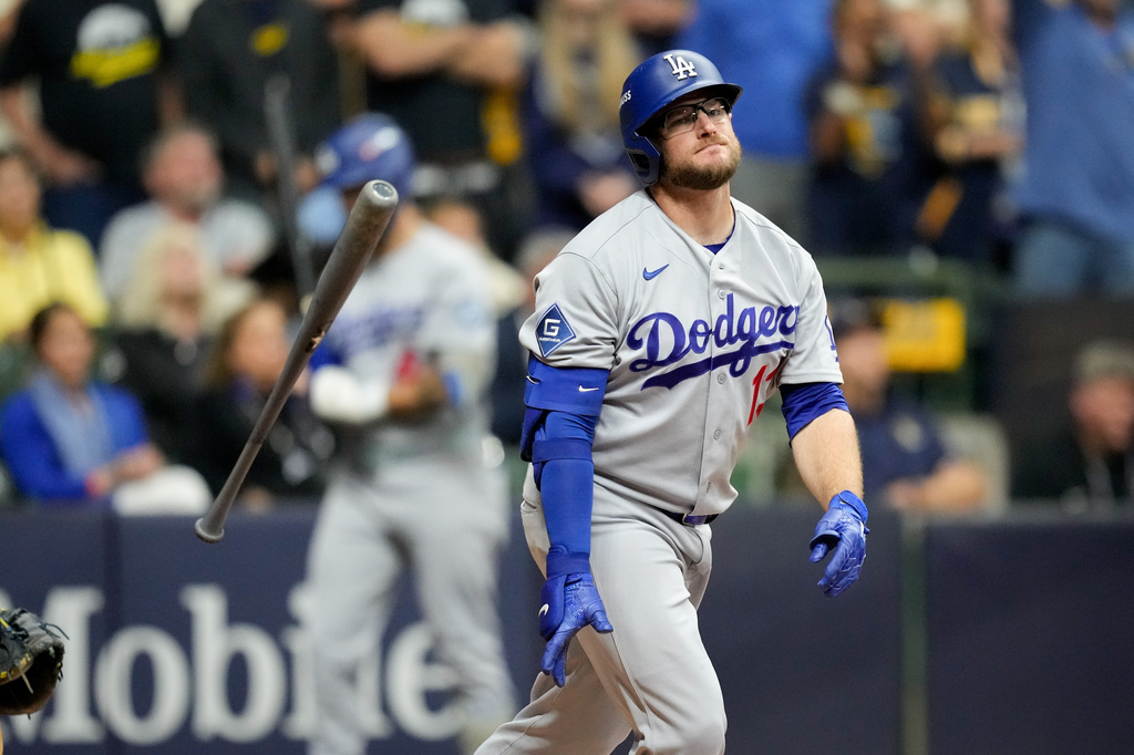 Los Angeles Dodgers third baseman Max Muncy flips his bat after popping out during the ninth inning of Game 1 of baseball's National League Championship Series between the Milwaukee Brewers and the Los Angeles Dodgers, Sunday, Oct. 11, 2026, in Milwaukee. (AP Photo/Ashley Landis)