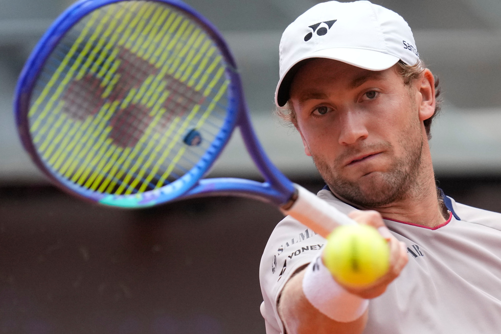 Casper Ruud, of Norway, returns the ball to Karen Khachanov, of Russia, during their quarter-final match at the Italian Open tennis tournament in Rome, Wednesday, May 13, 2026. (AP Photo/Gregorio Borgia)