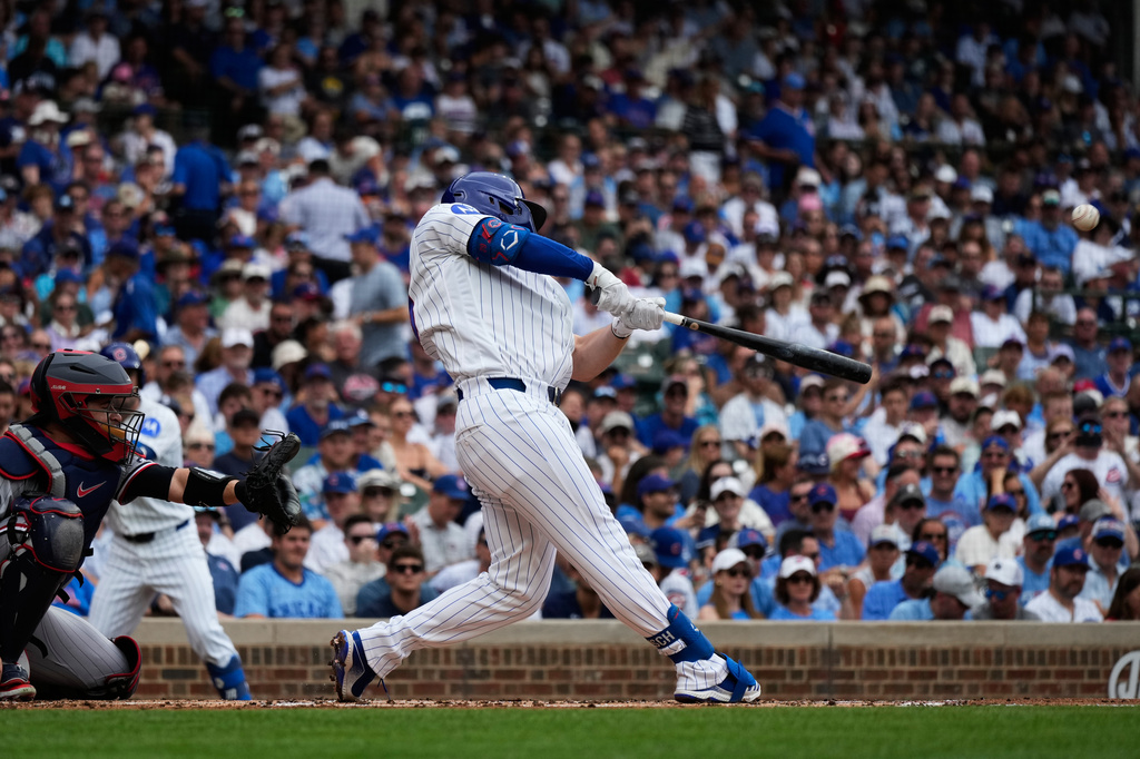 Chicago Cubs' Michael Busch hits a solo home run during the first inning of a baseball game against the Minnesota Twins in Chicago, Saturday, July 18, 2026. (AP Photo/Nam Y. Huh)