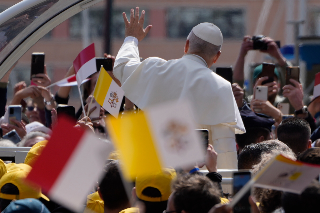 Pope Leo XIV arrives to meet with a group of young people and catechumens outside Sainte Dévote Church in La Condamine, Monaco, Saturday, March 28, 2026. (AP Photo/Gregorio Borgia)