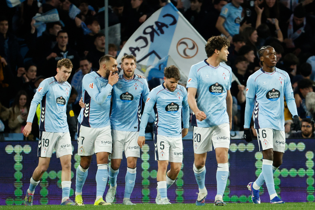Celta's Borja Iglesias, second left, celebrates after scoring his side's first goal during a Spanish La Liga soccer match between Celta Vigo and Real Madrid in Vigo, Spain, Friday, March 6, 2026. (AP Photo/Lalo R. Villar)
