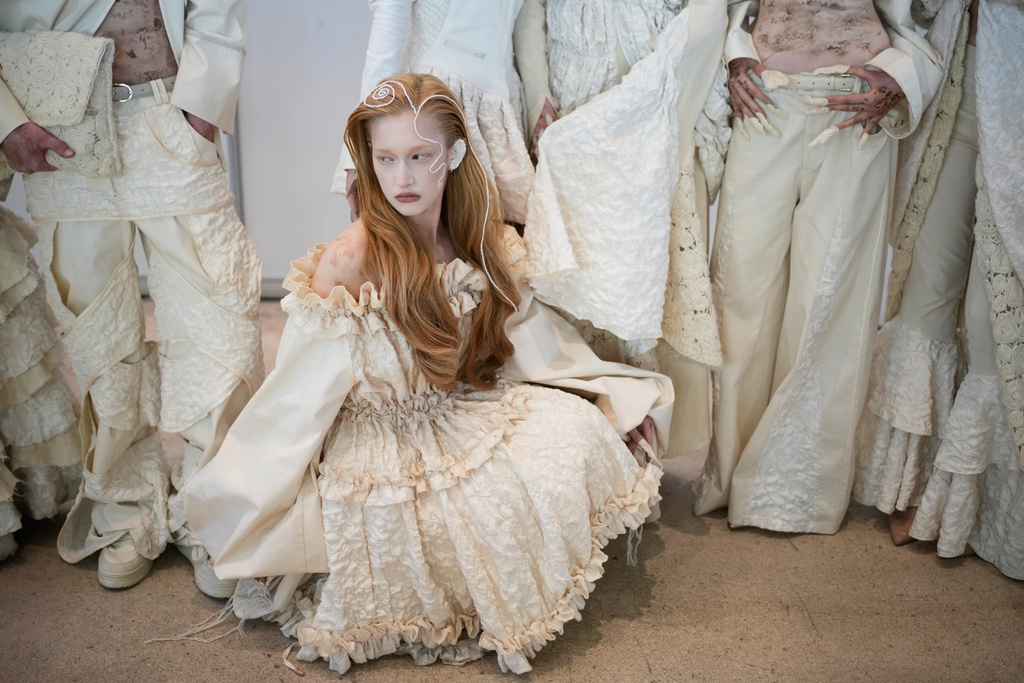 Models wait backstage to take the runway at Moscow Fashion Week in Moscow, Wednesday, March 18, 2026. (AP Photo/Pavel Bednyakov)