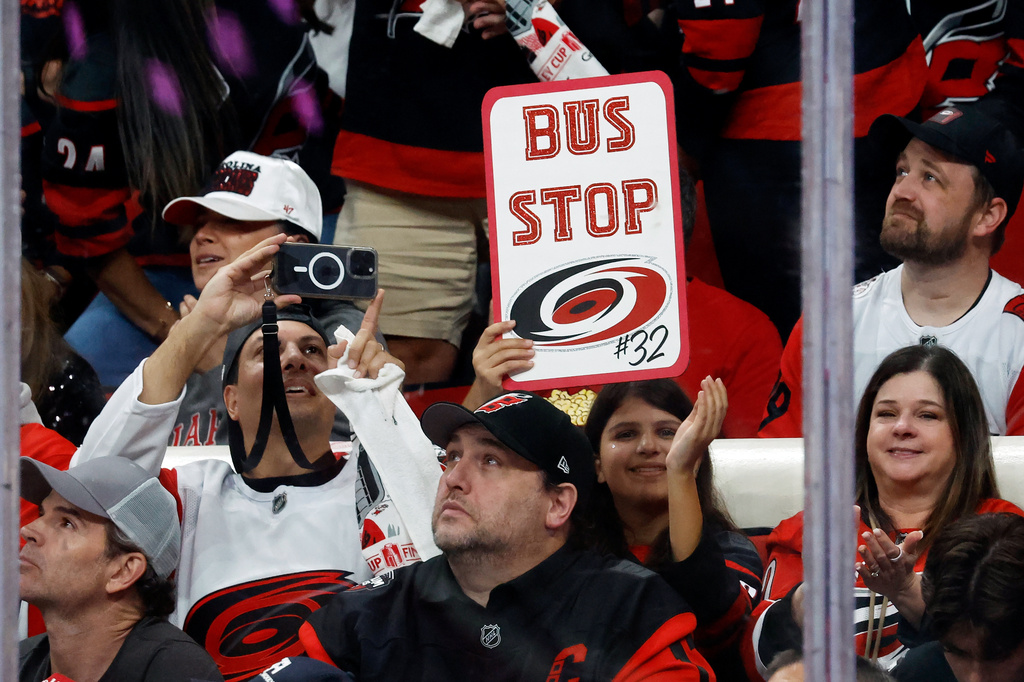 Carolina Hurricanes celebrate goaltender Brandon Bussi (32) starting against Vegas Golden Knights during the first period in Game 5 of the NHL hockey Stanley Cup Final series in Raleigh, N.C., Thursday, June 11, 2026. (AP Photo/Karl DeBlaker)