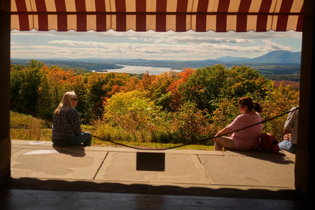 Colorful foliage adds to the view overlooking the Hudson River and Catskill Mountains at Olana, the former home of celebrated painter Frederic Church, Monday, Oct. 12, 2026, in Hudson, N.Y. (AP Photo/Robert F. Bukaty)