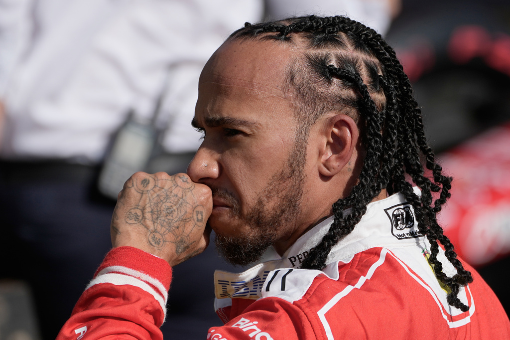 Ferrari driver Lewis Hamilton of Britain reacts after he clocked the third fastest time during the qualifying session ahead of the British F1 Grand Prix, in Silverstone, England, Saturday, July 4, 2026. (AP Photo/Darko Bandic)