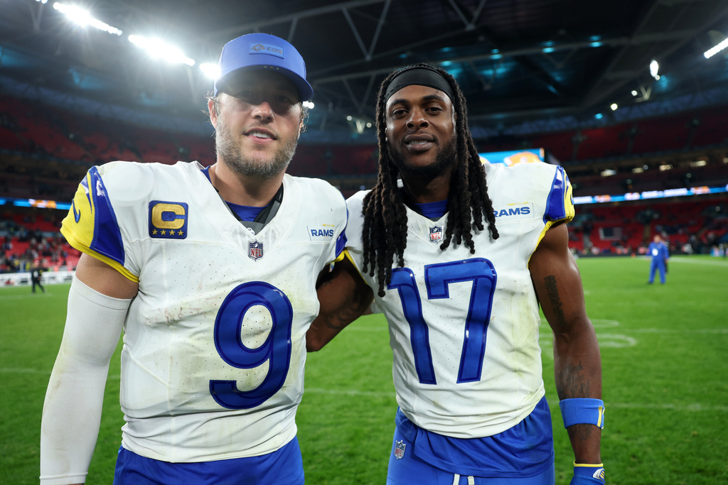 Los Angeles Rams quarterback Matthew Stafford (9) and wide receiver Davante Adams (17) stand on the field after an NFL football game between the Los Angeles Rams and the Jacksonville Jaguars in London, Sunday, Oct. 19, 2025. (AP Photo/Ian Walton)