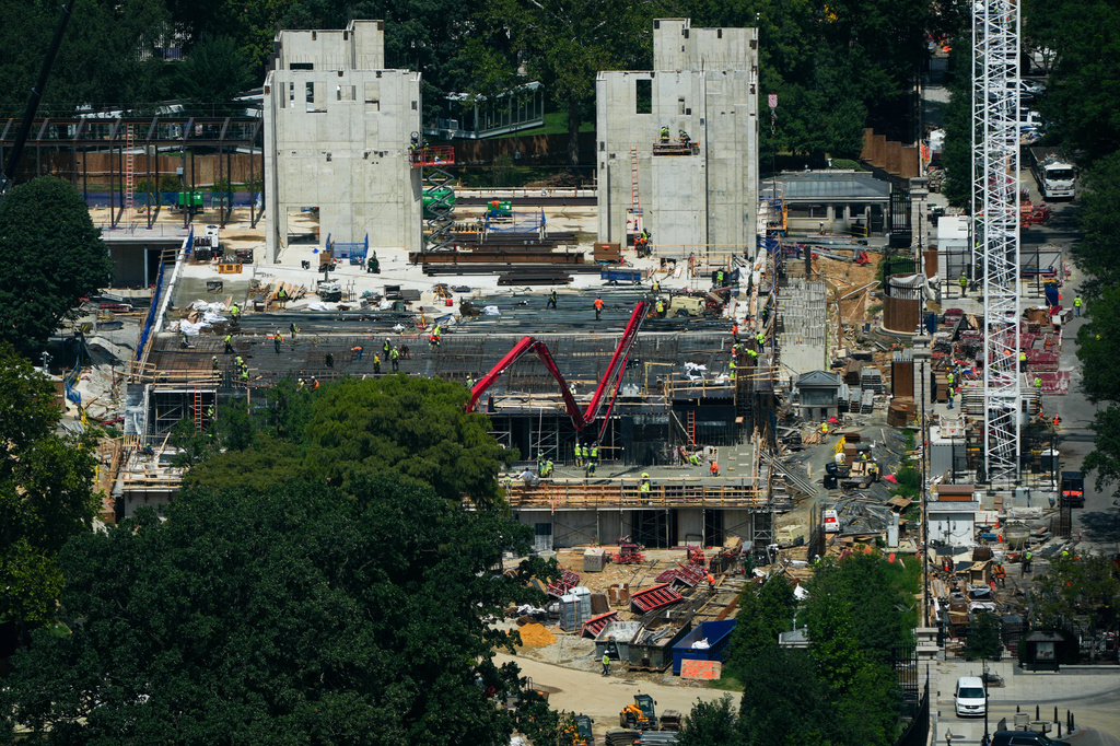Workers continue construction on the new White House ballroom, as seen from the Washington Monument, Monday, Aug. 17, 2026, in Washington. (AP Photo/Julia Demaree Nikhinson)