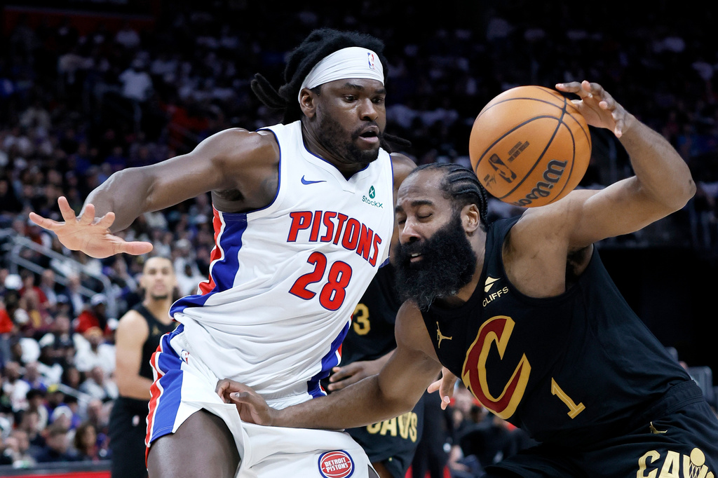 Cleveland Cavaliers guard James Harden (1) drives against Detroit Pistons forward Isaiah Stewart (28) during the first half in Game 1 of a second-round NBA playoffs basketball series Tuesday, May 5, 2026, in Detroit. (AP Photo/Duane Burleson)