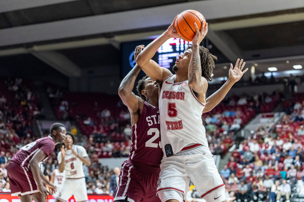 Alabama forward Amari Allen (5) works for a shot against Mississippi State guard King Grace during the first half of an NCAA college basketball game, Wednesday, Feb. 25, 2026, in Tuscaloosa, Ala. (AP Photo/Vasha Hunt)