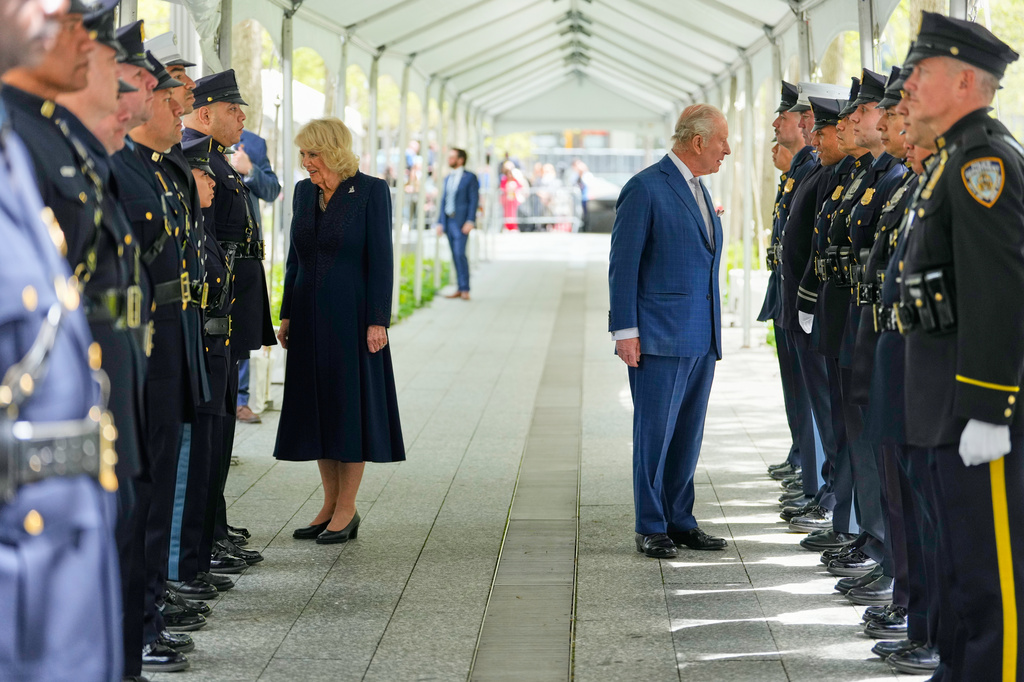 Britain's King Charles III, right, and Queen Camilla greet first responders during a visit to the 9/11 Memorial, Wednesday, April 29, 2026, in New York. (AP Photo/Yuki Iwamura, Pool)