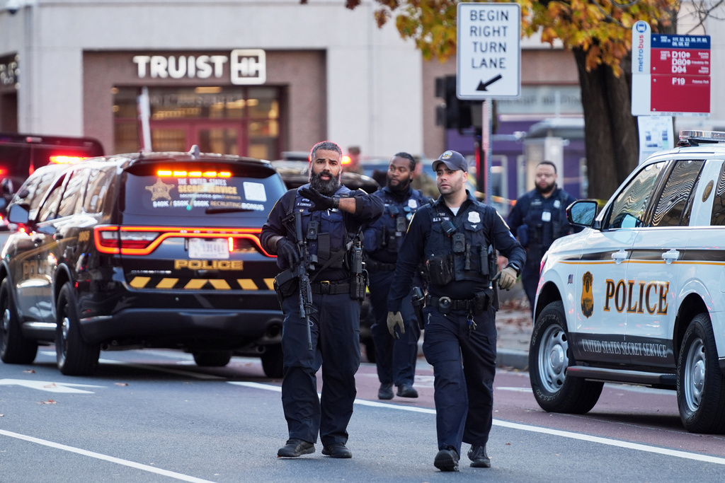 Washington Metropolitan Police are seen after reports of two National Guard soldiers were shot near the White House in Washington, Wednesday, Nov. 26, 2025. (AP Photo/Evan Vucci)