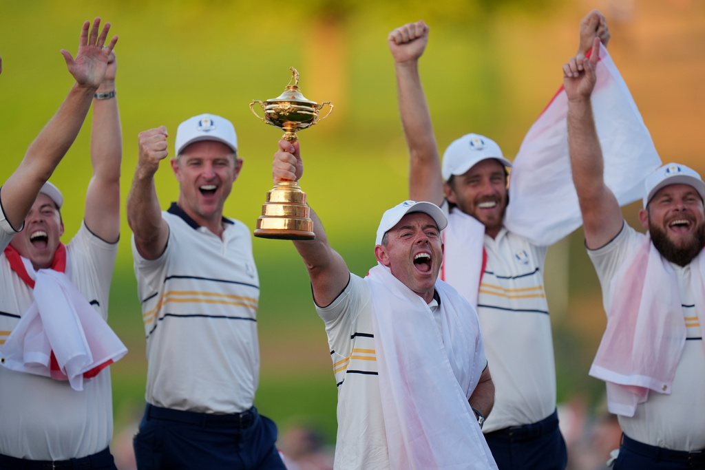 Europe's Rory McIlroy poses with the trophy after winning the Ryder Cup golf tournament against the United States on the Bethpage Black golf course, Sunday, Sept. 28, 2025, in Farmingdale, N.Y. (AP Photo/Seth Wenig)