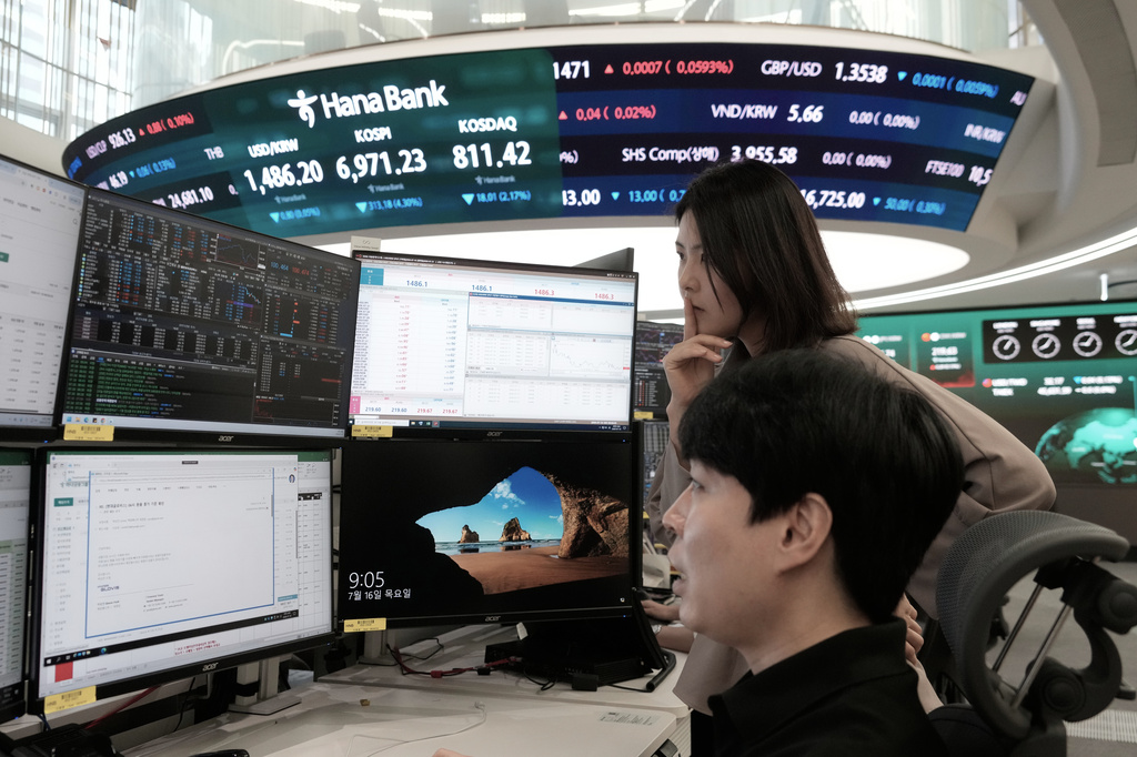 Currency traders watch monitors at the foreign exchange dealing room of the Hana Bank headquarters in Seoul, South Korea, Thursday, July 16, 2026. (AP Photo/Ahn Young-joon)