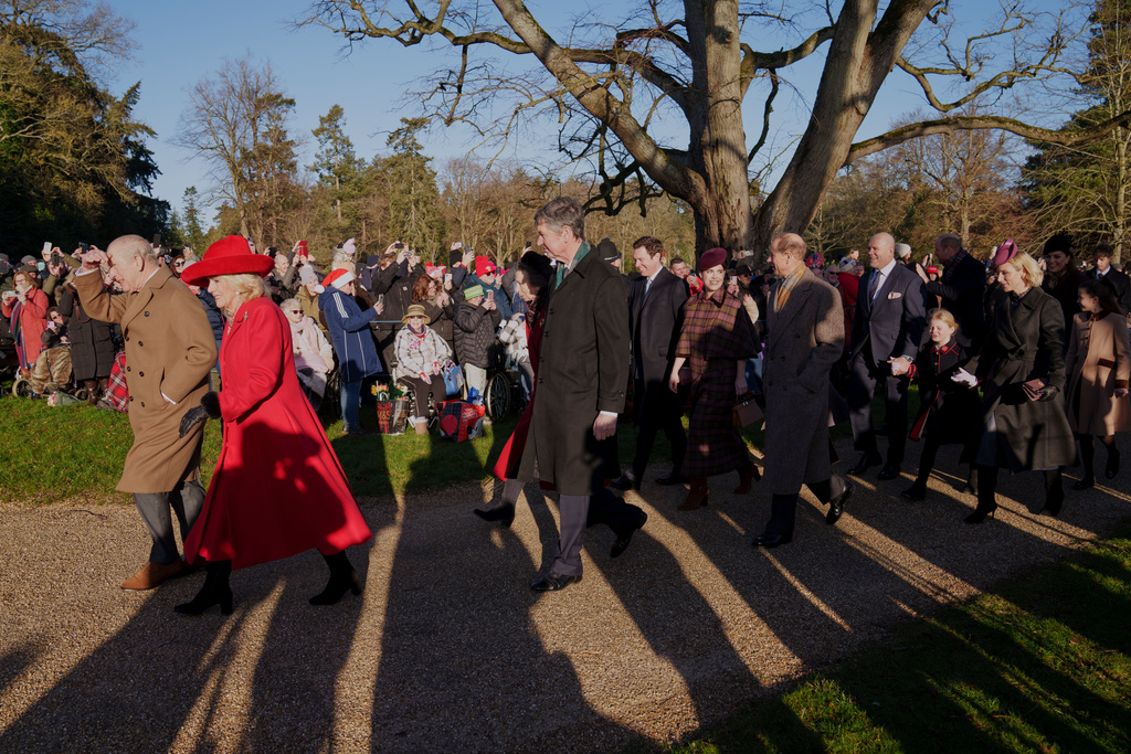 Britain's King Charles III and Queen Camilla lead as they arrive to attend the Christmas Day service at St Mary Magdalene Church in Sandringham, Norfolk, England, Thursday, Dec. 25, 2025.(AP Photo/Jon Super)
