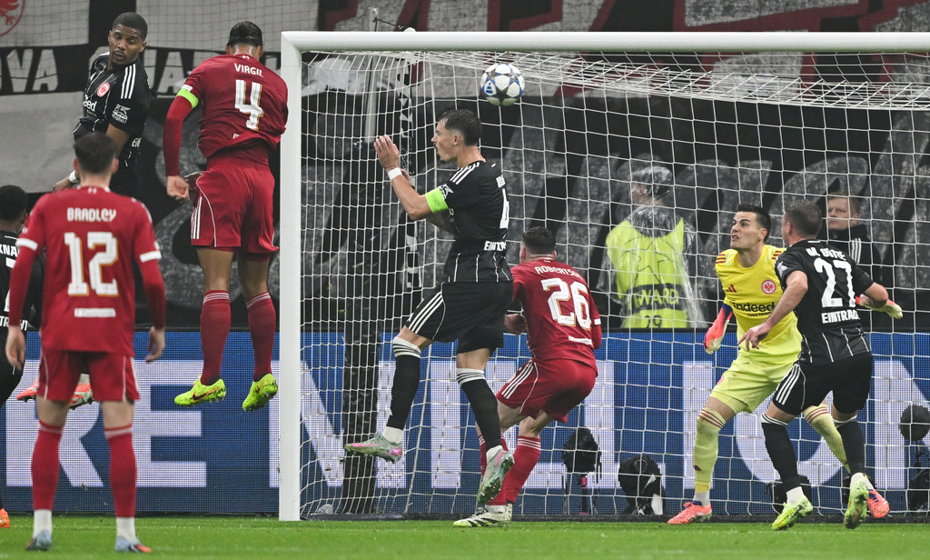 Liverpool's Virgil van Dijk scores his side's second goal during the Champions League opening phase soccer match between Eintracht Frankfurt and Liverpool in Frankfurt, Germany, Wednesday, Oct. 22, 2025. (Arne Dedert/dpa via AP)